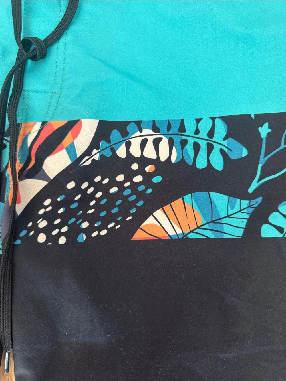 Youth Teal and Black Swim Trunks with Tropical Print